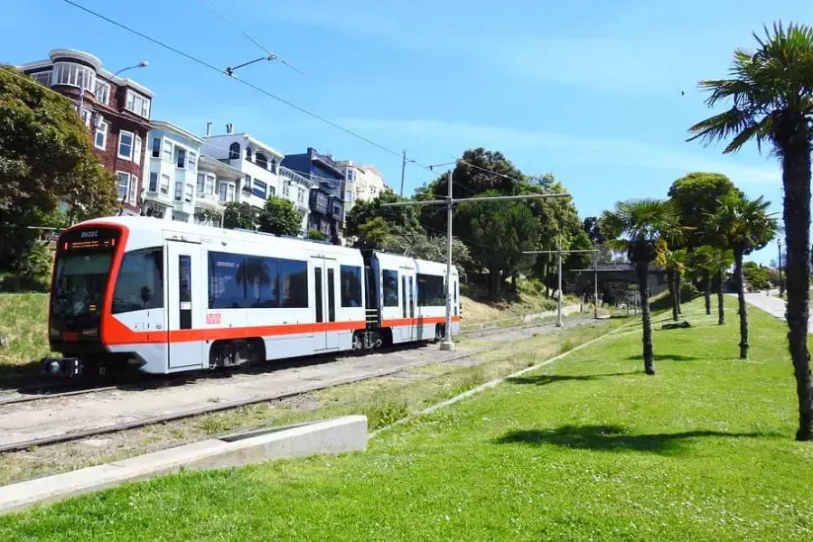 A MUNI passenger train runs along a track in 贝博体彩app.